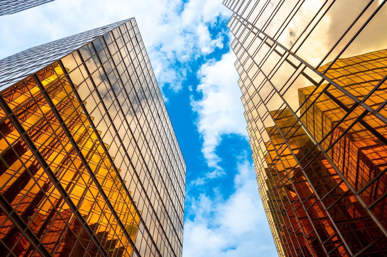 Golden skyscraper building against a blue sky